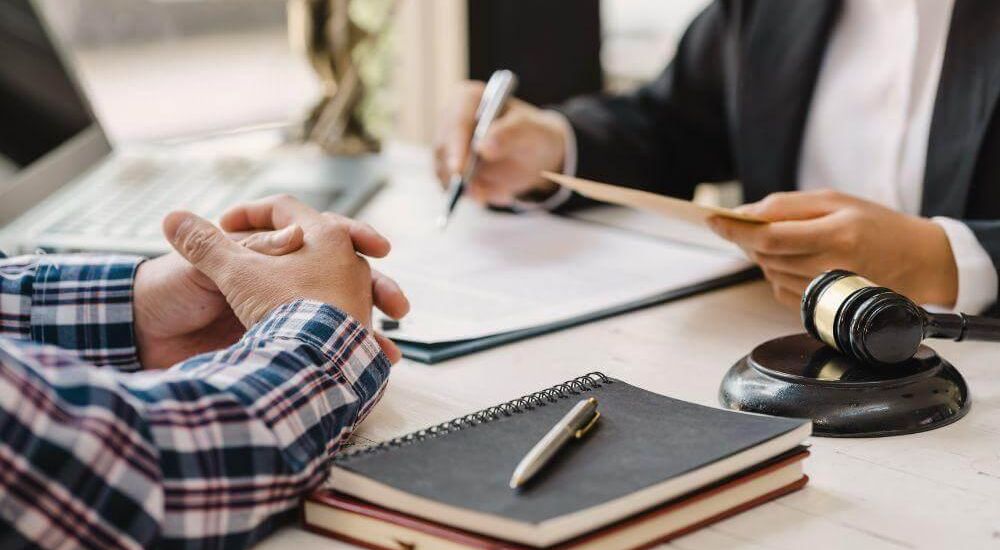 Client reviewing documents with a Virginia dog bite attorney at