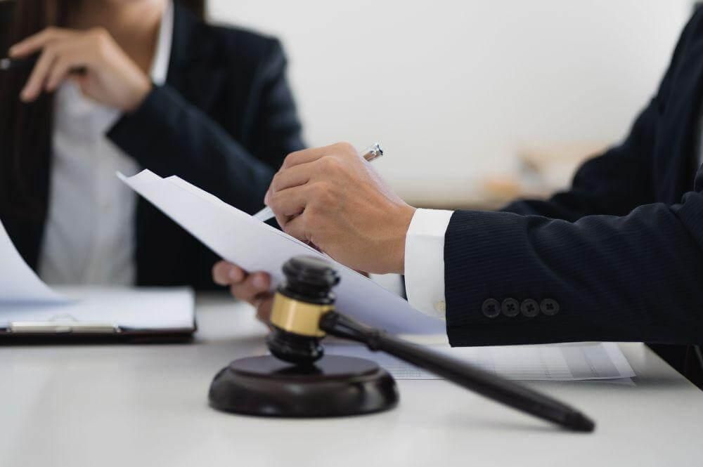 wp-content/uploads/2026/07/two-people-and-judge-s-gavel.jpeg