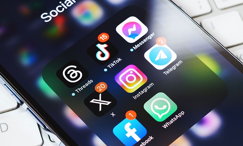 social media app icons like TikTok, Instagram, Facebook, and WhatsApp with notifications.