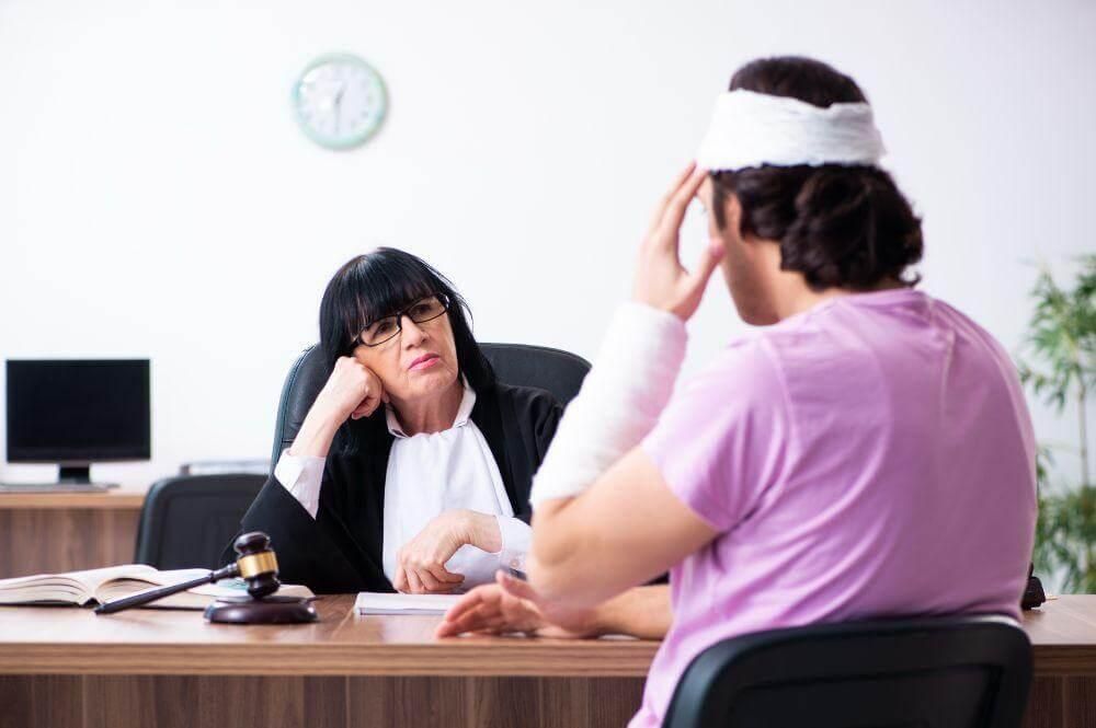 wp-content/uploads/2026/07/woman-with-a-judge-discussing-head-injury-compensation.jpeg
