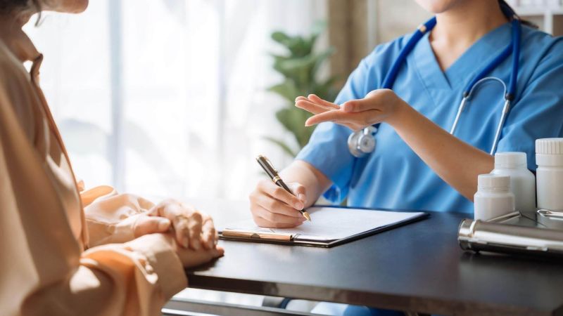 A doctor in uniform with a clipboard,