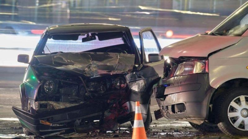 a couple of cars that are sitting in the street