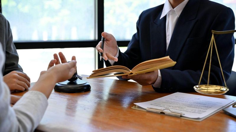 Person researching legal case for car accident lawsuit