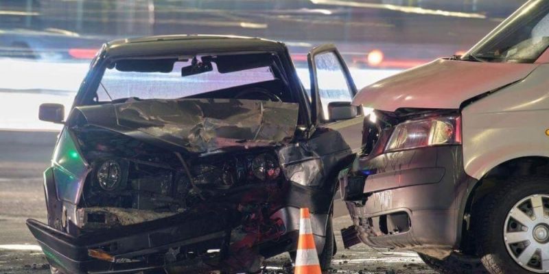 a couple of cars that are sitting in the street