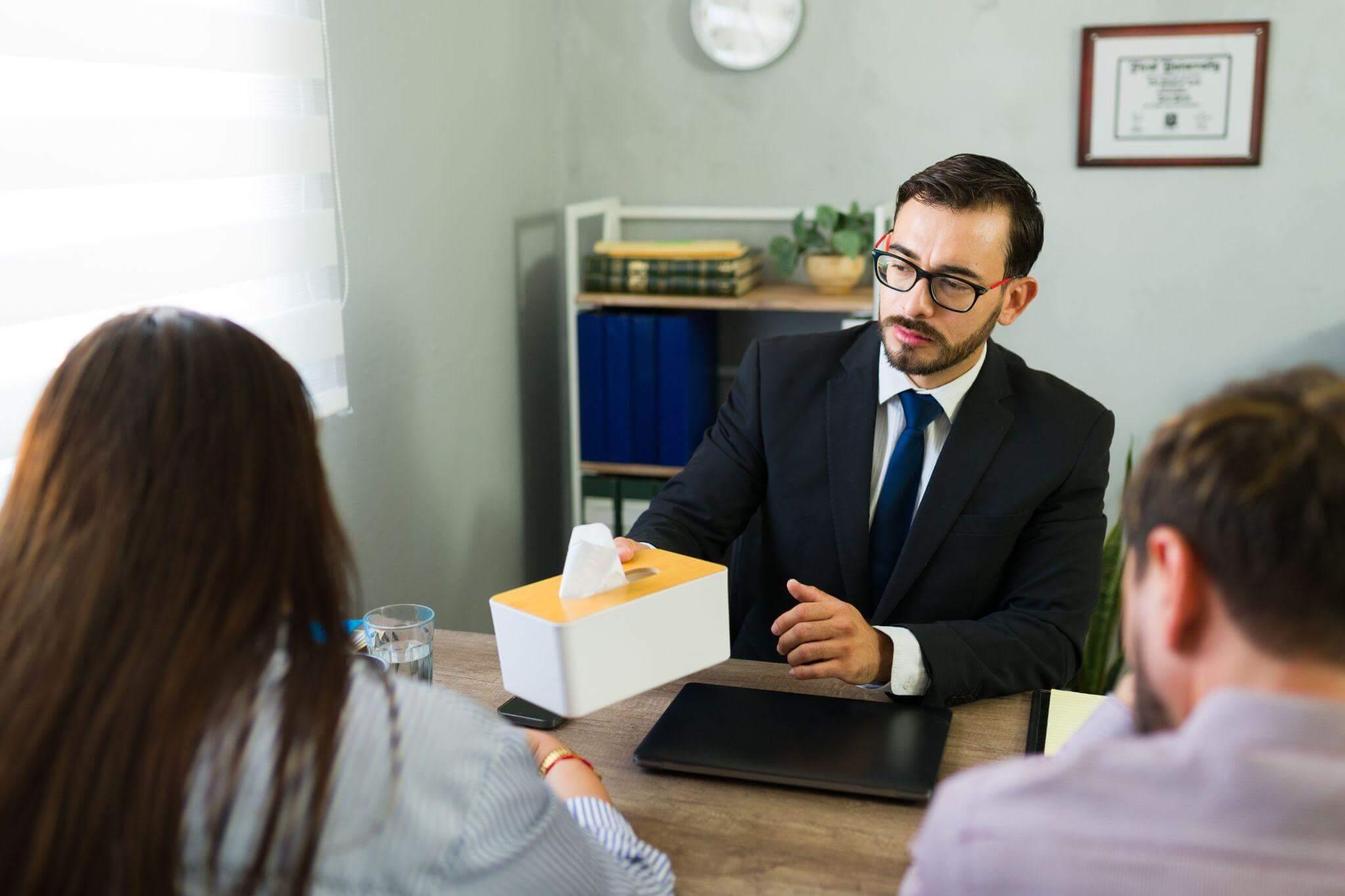 Man at a table reviewing documents related to a wrongful