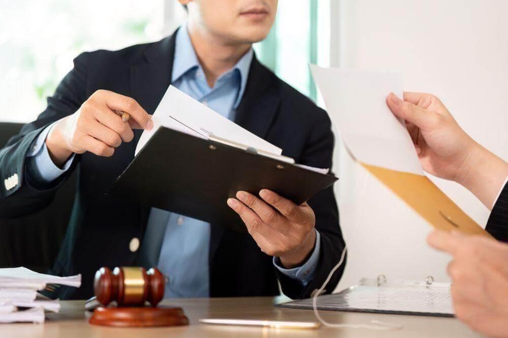 Two men reviewing documents for a wrongful death