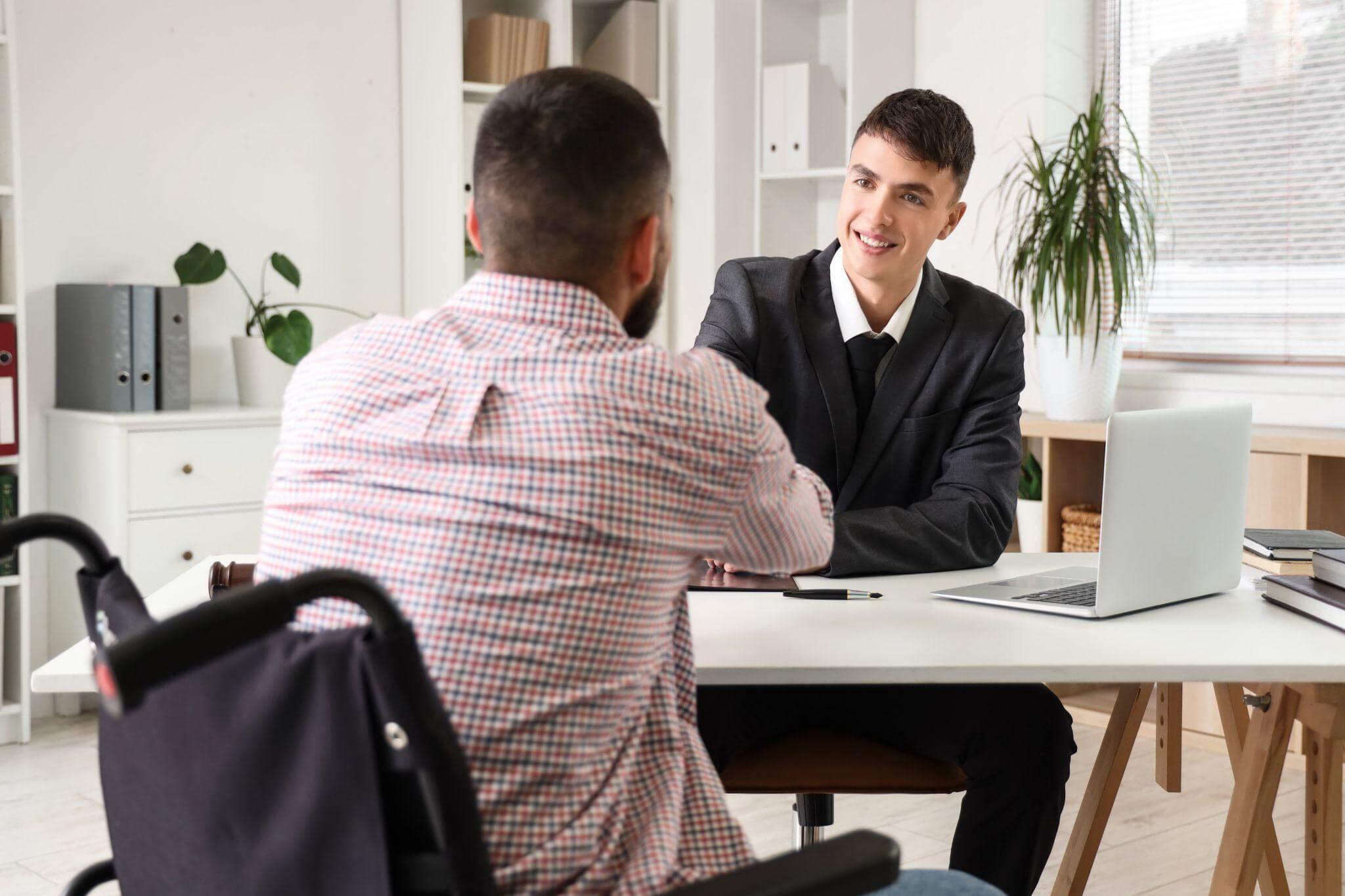 Two men shaking hands during a client