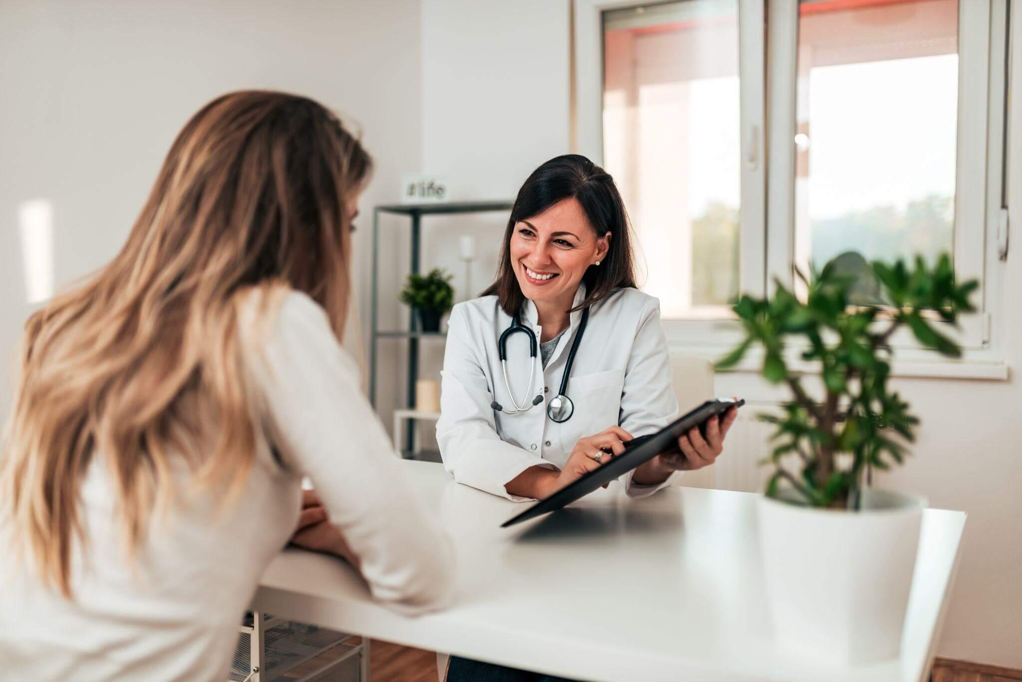 Woman consulting a doctor about her health and legal claim